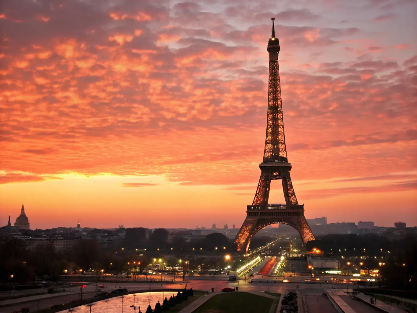A stunning aerial view of the Eiffel Tower in Paris at sunset, showcasing the romantic ambiance of a European getaway. The image should evoke feelings of excitement and wanderlust.